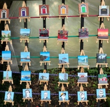 Many mini paintings with easel